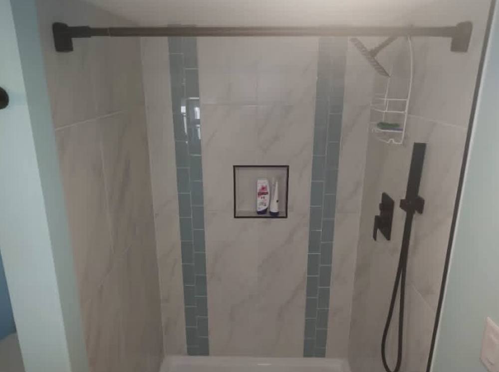 Tile shower with accent stripes