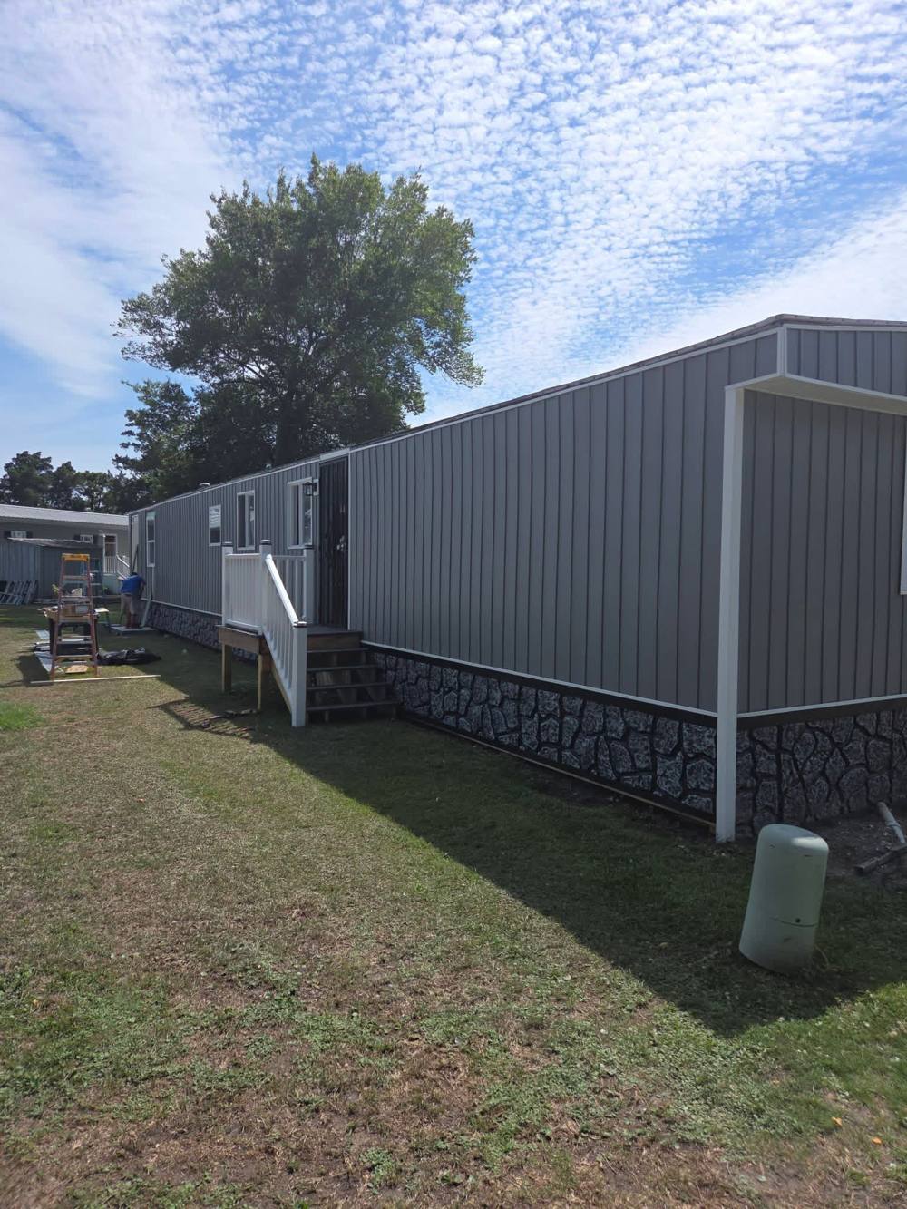 Finished trailer with new siding and skirting